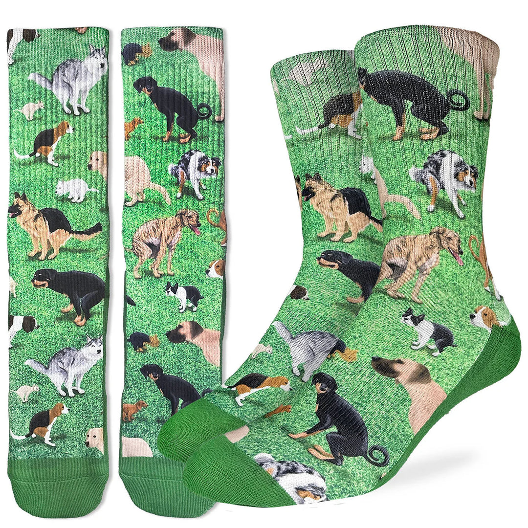 Green socks with dog taking a poop pattern 