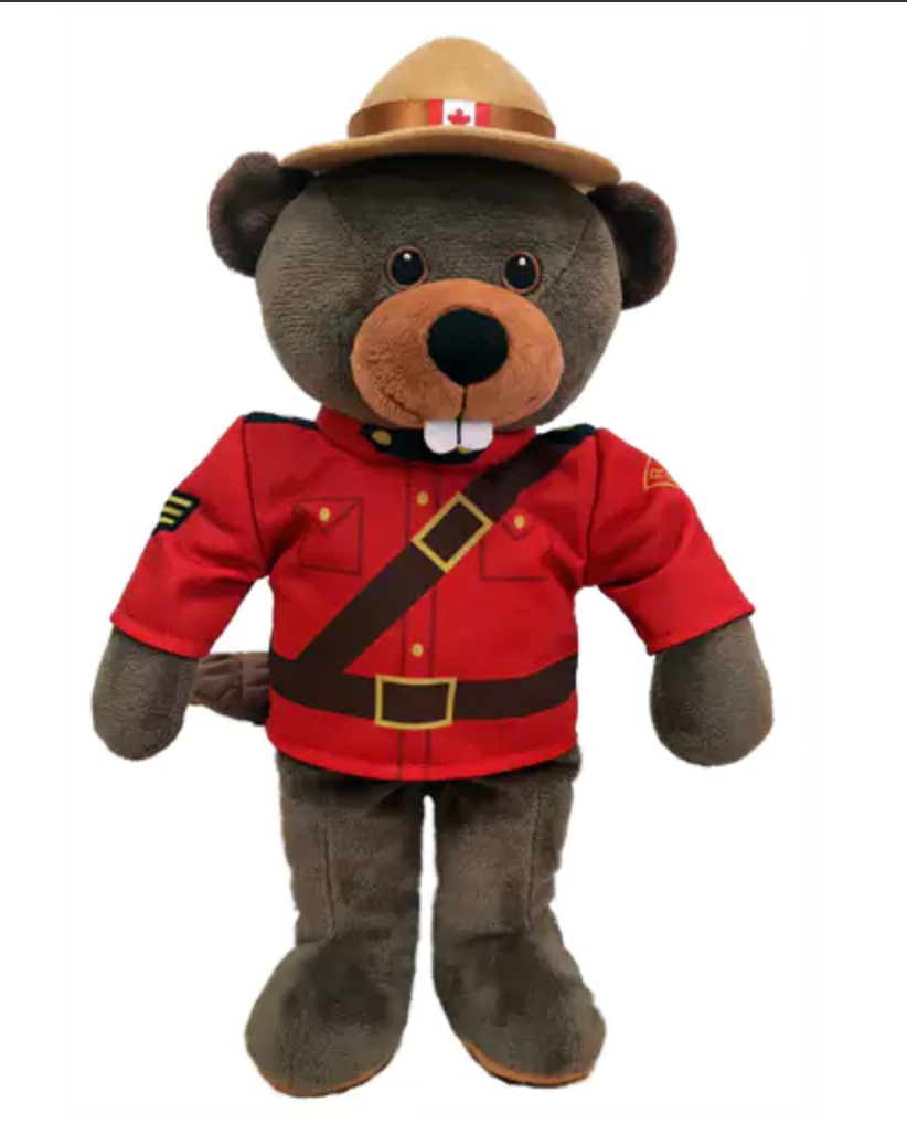 Plush toy bear wearing a red uniform and hat with a Canadian flag on a white background